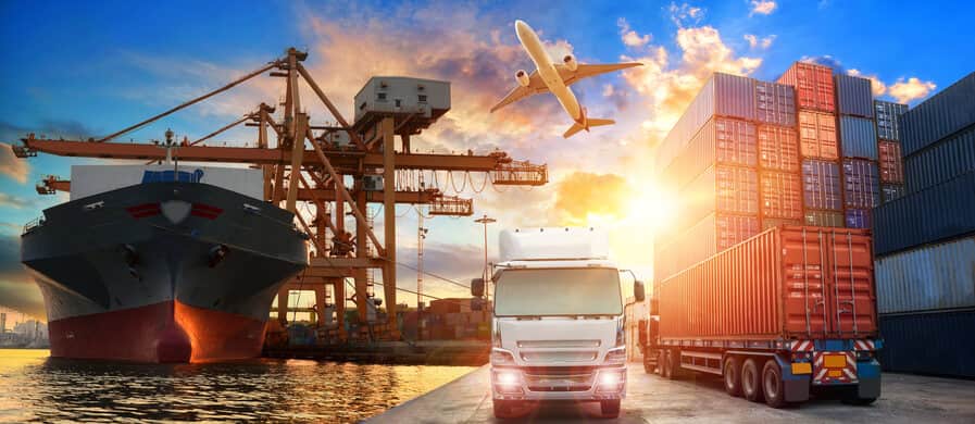 Cargo ship, trucks, containers and an aircraft illustrating multimodal freight transport.