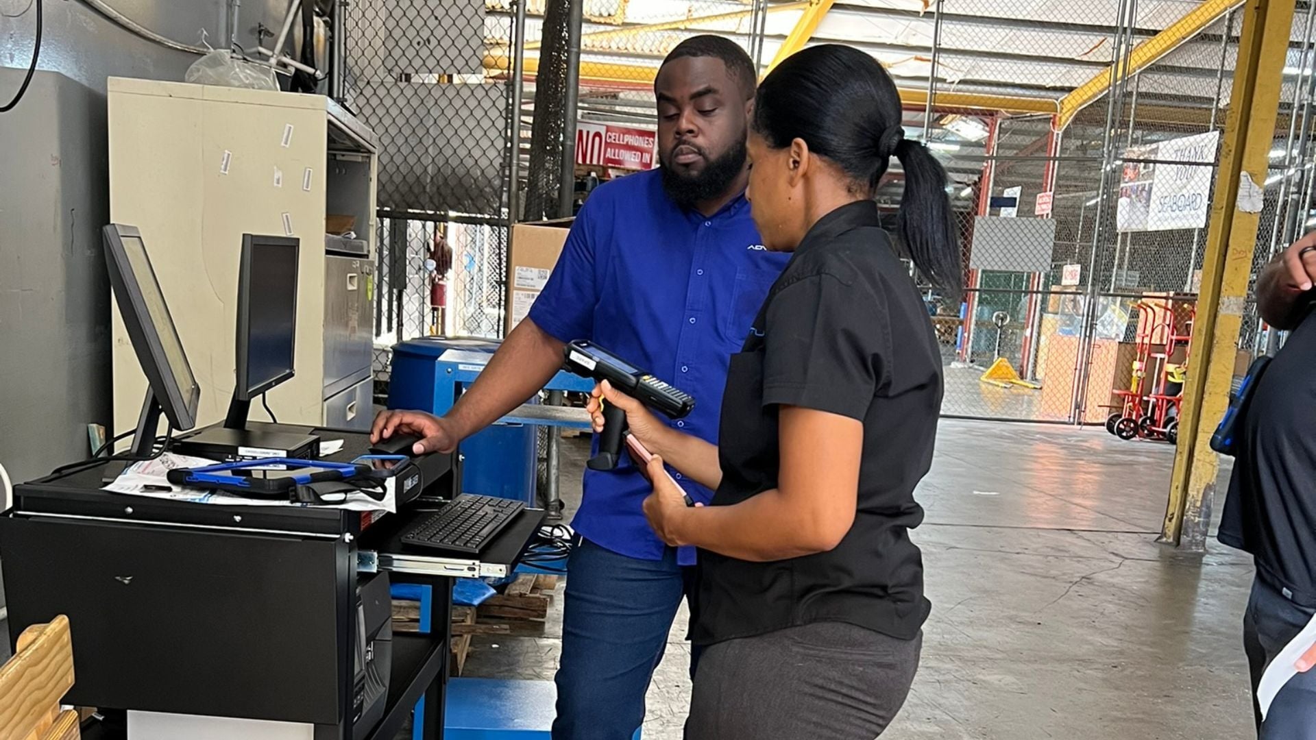 Warehouse team using barcode scanning technology to manage inventory